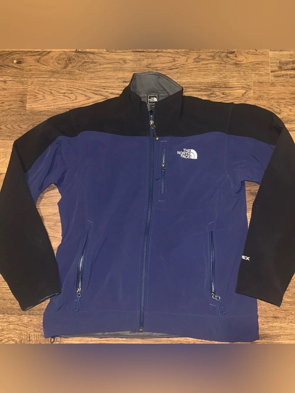 The North Face Men’s Blue and Black Softshell Jacket